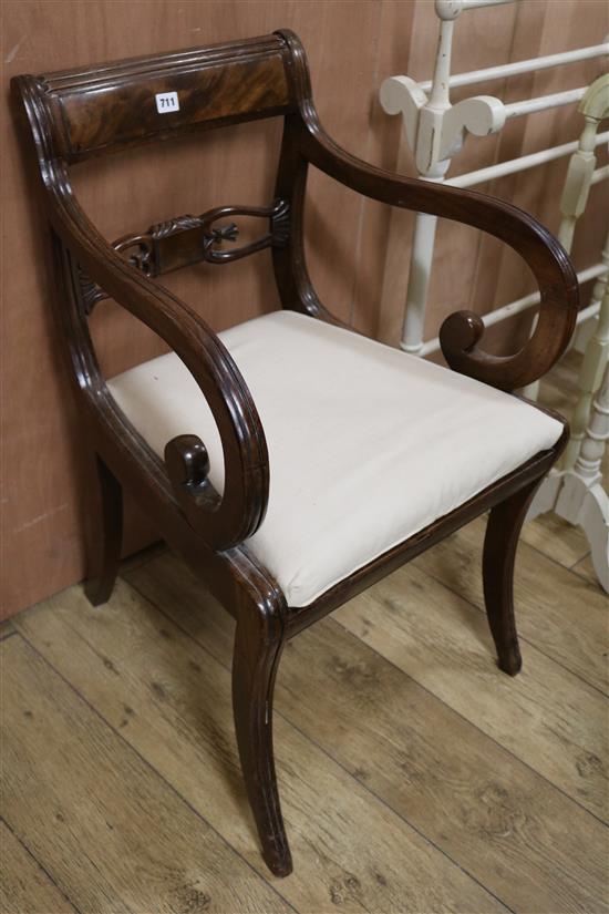 A mahogany scroll arm carver chair